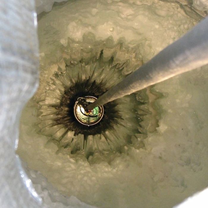 Gap in Neutrino Energy Spectrum Raises Questions About Cosmic Environments